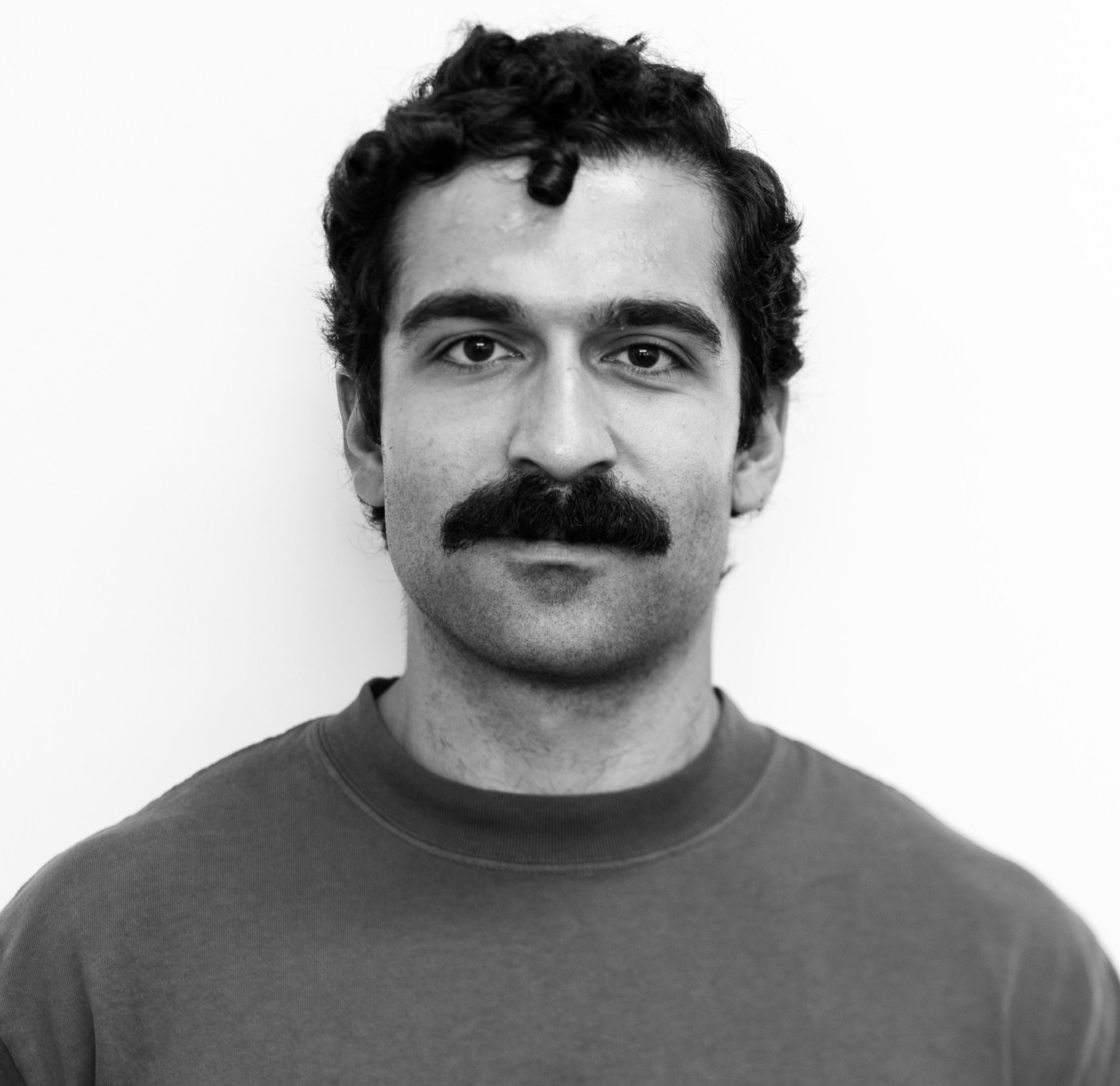 Black-and-white headshot of Greg Berberian